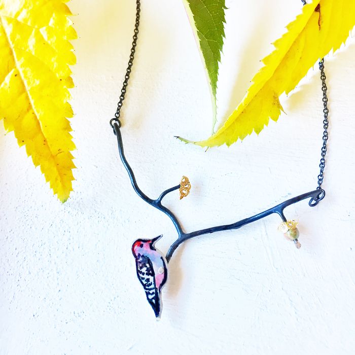 Woodpecker with acorn necklace